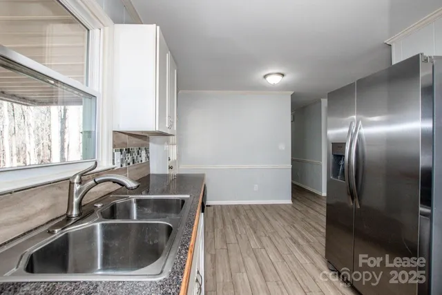 a kitchen with a stove and a sink