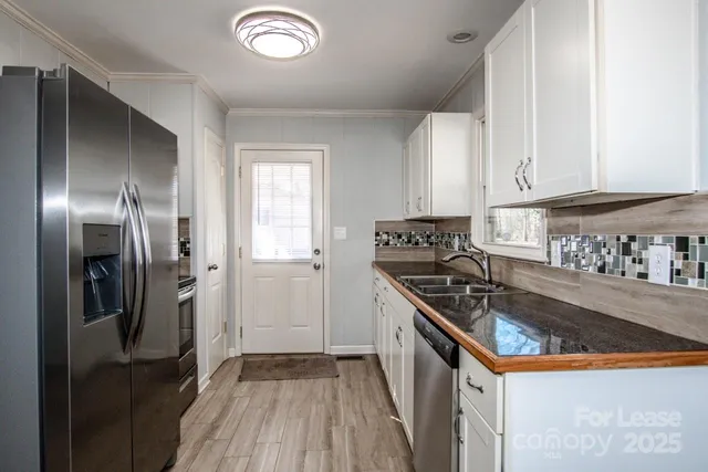 a view of room with hardwood floor and window