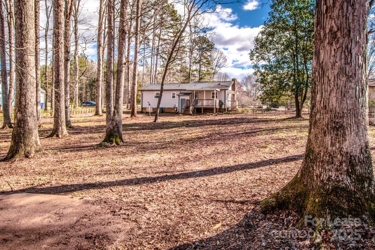 1159 Camp Creek Road Iron Station, NC 28080 - Photo 48 of 48 a view of a house with a trees in the background