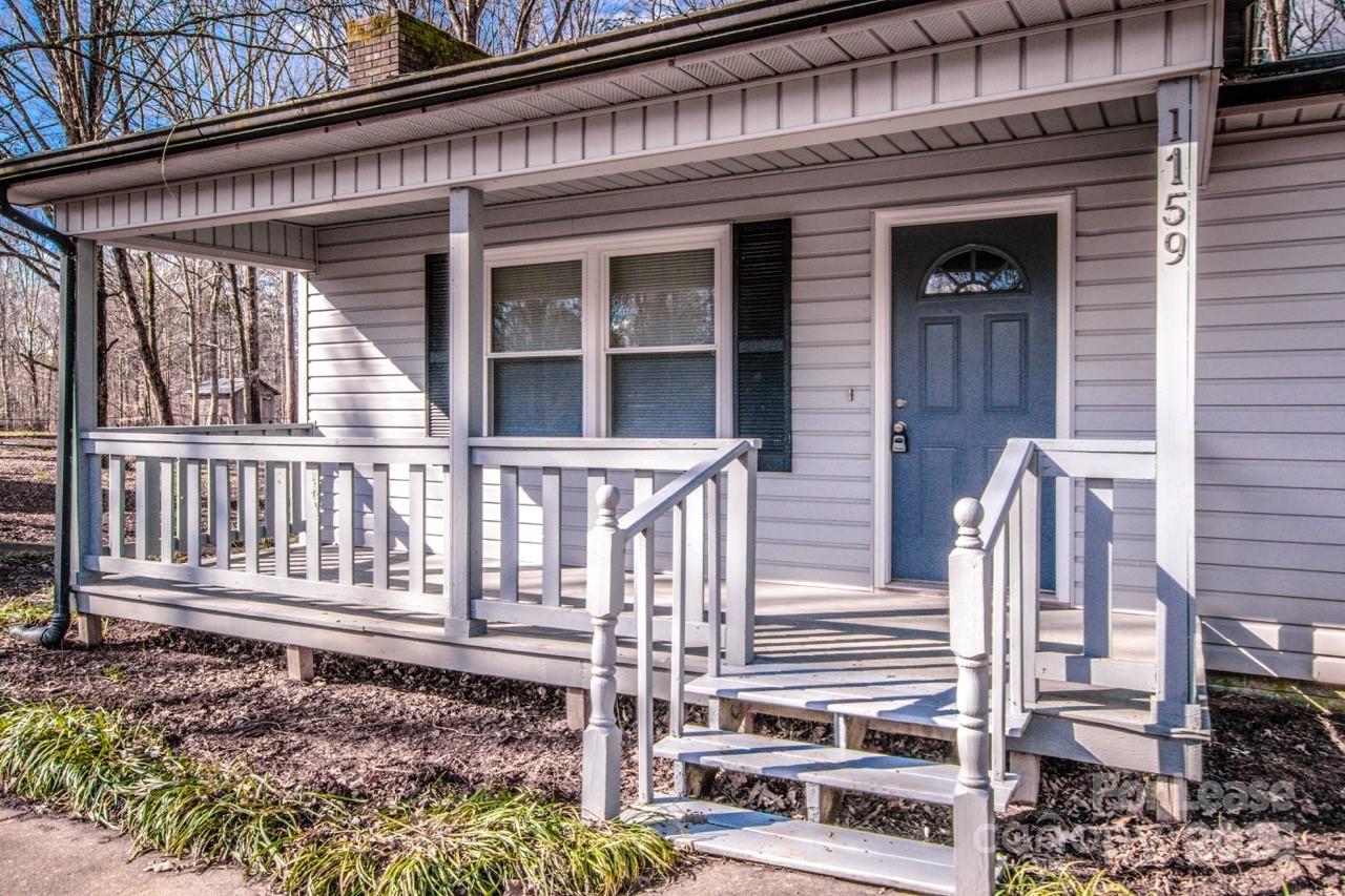 1159 Camp Creek Road Iron Station, NC 28080 - Photo 9 of 48 a front view of a house with a porch