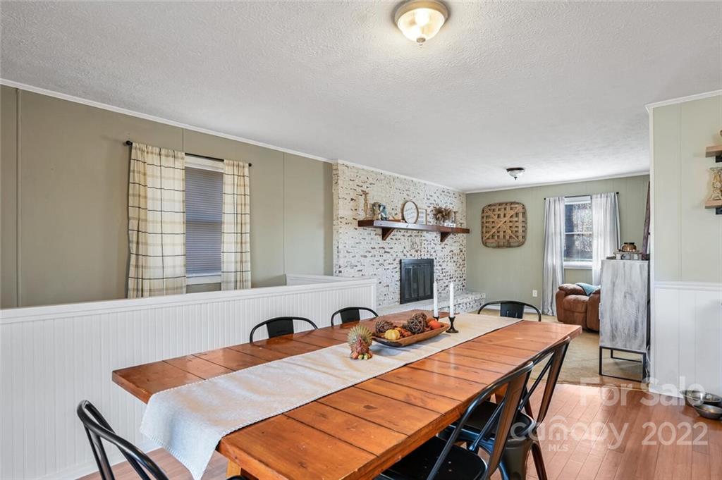 685 Kims Cove Road Canton, NC 28716 - Photo 13 of 43 a view of a dining room and a table and chairs in a room