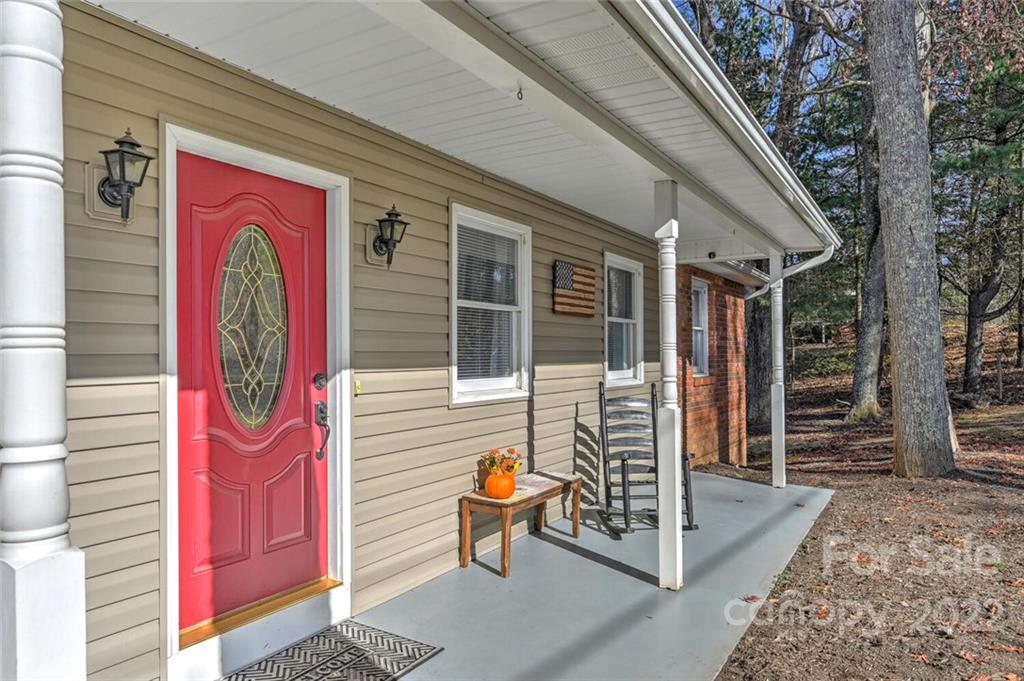 685 Kims Cove Road Canton, NC 28716 - Photo 3 of 43 a front view of a house with large windows