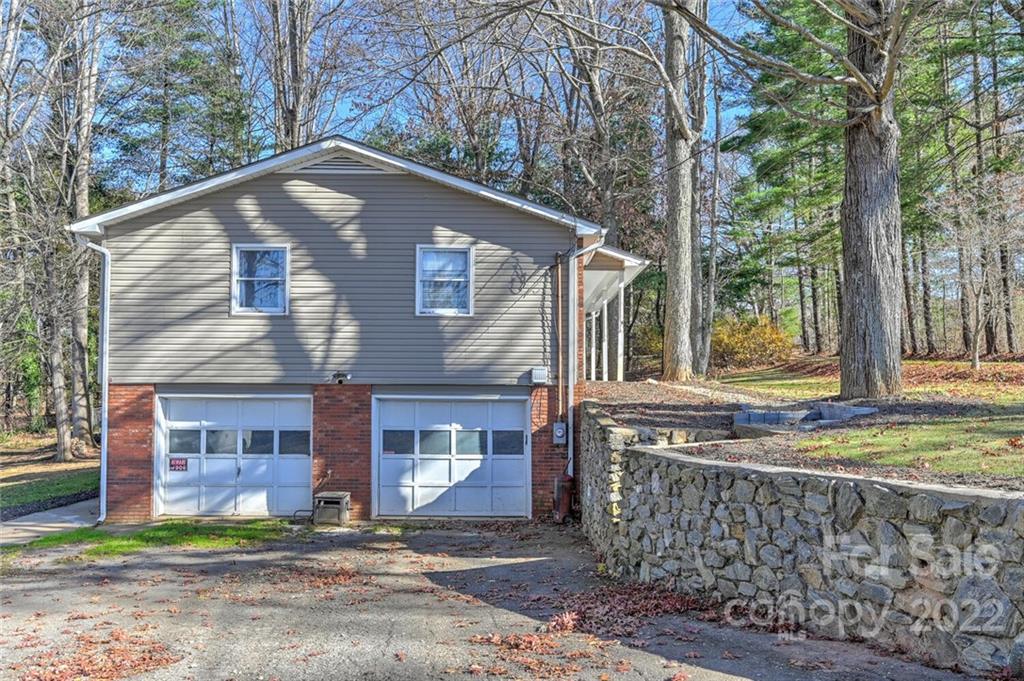 685 Kims Cove Road Canton, NC 28716 - Photo 33 of 43 a front view of a house with garden