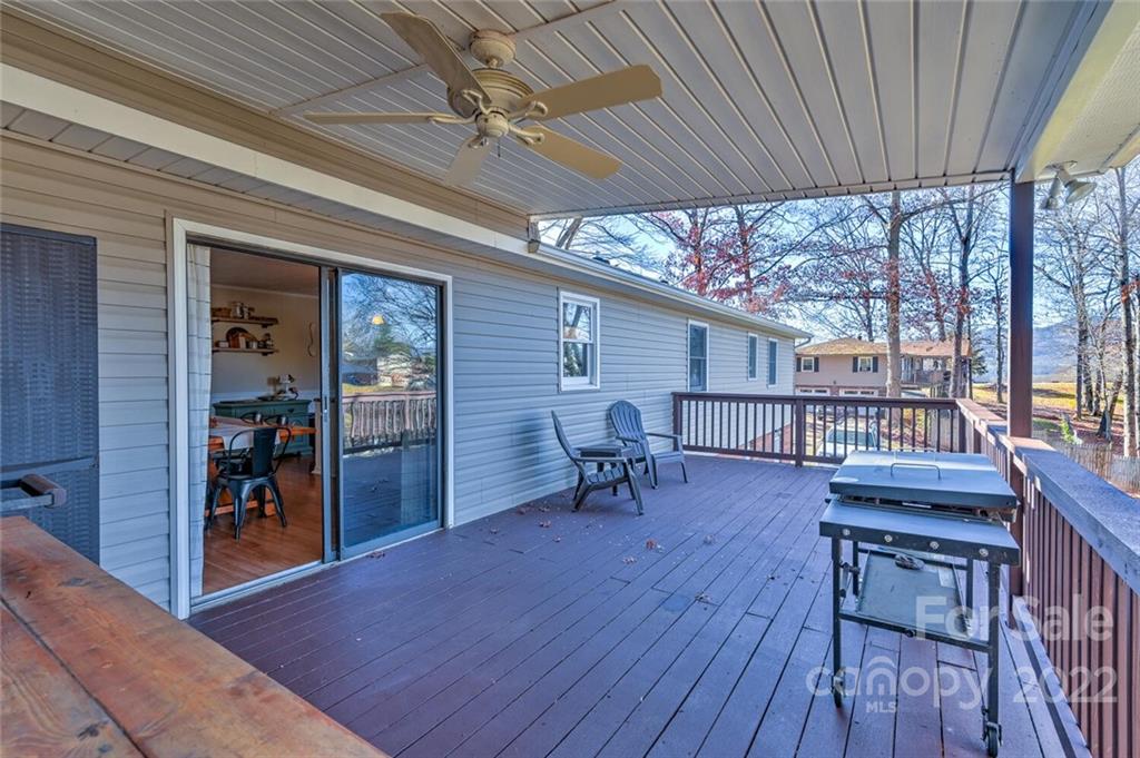 685 Kims Cove Road Canton, NC 28716 - Photo 37 of 43 a view of a porch with furniture and a yard