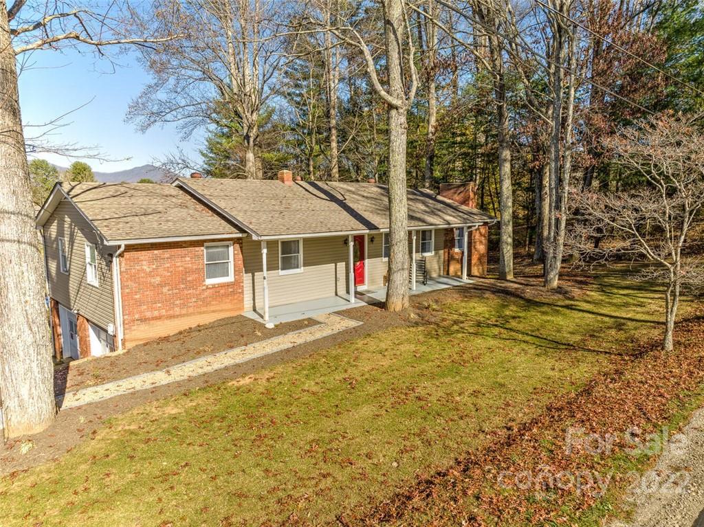 685 Kims Cove Road Canton, NC 28716 - Photo 38 of 43 a house view with swimming pool in front of it