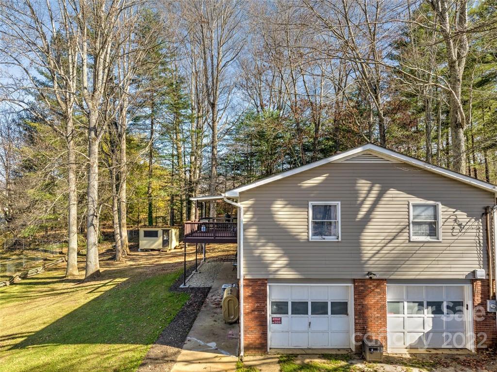685 Kims Cove Road Canton, NC 28716 - Photo 40 of 43 a front view of a house with a yard