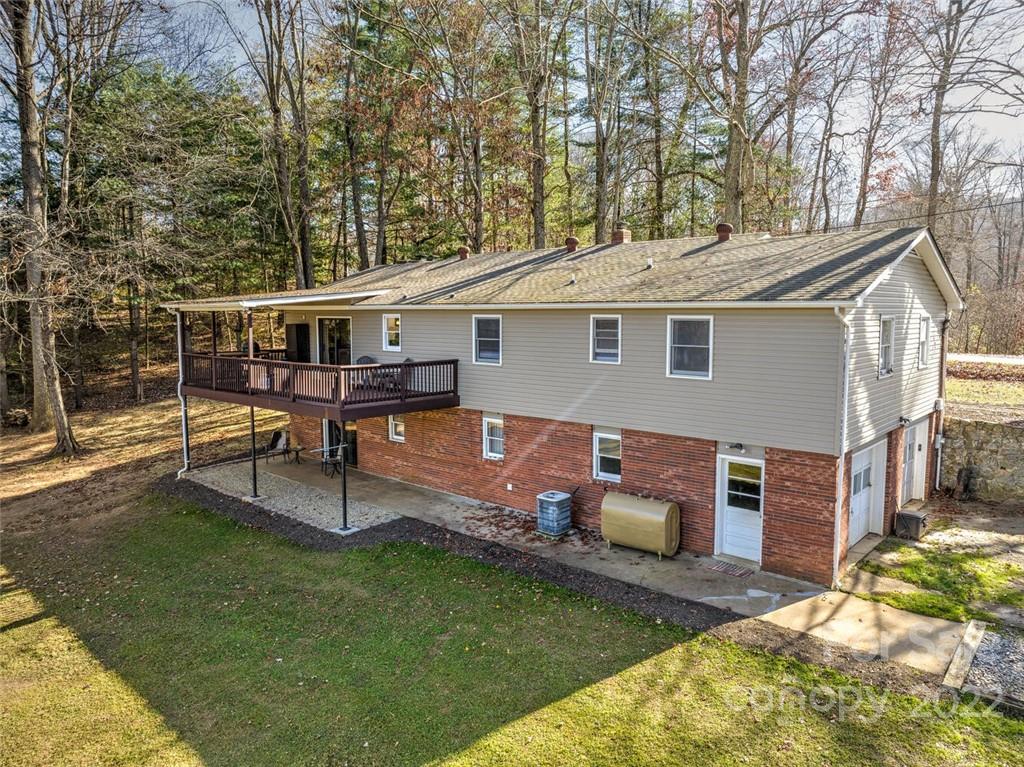 685 Kims Cove Road Canton, NC 28716 - Photo 41 of 43 a house view with a seating space and garden