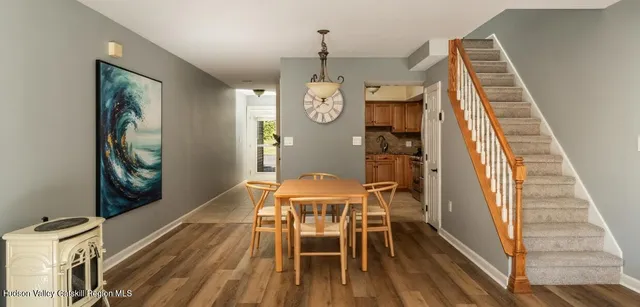 a bedroom with a bed and painting on the wall
