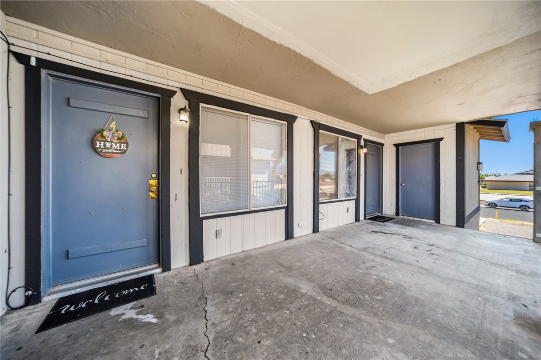 793 Baseline Road Bullhead City, AZ 86442 - Photo 9 of 49 Covered entry with concrete flooring