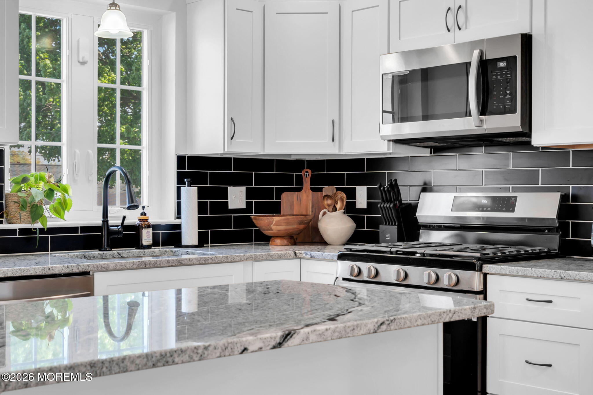 312 Beach Boulevard Forked River, NJ 08731 - Photo 20 of 40 a kitchen with stainless steel appliances granite countertop a stove and a microwave