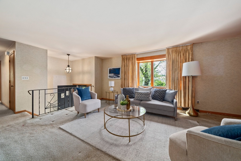 129 Devon Road Norwood, MA 02062 - Photo 11 of 32 a living room with furniture and a large window