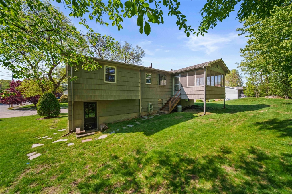 129 Devon Road Norwood, MA 02062 - Photo 28 of 32 a view of a house with a yard