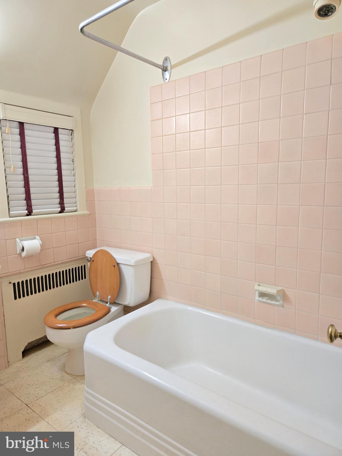 1003 Church Road Oreland, PA 19075 - Photo 11 of 18 a bathroom with a toilet and a bathtub
