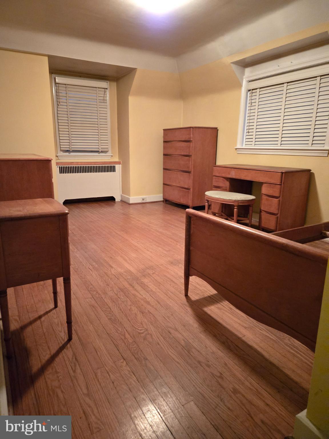 1003 Church Road Oreland, PA 19075 - Photo 14 of 18 a room with wooden floor and furniture