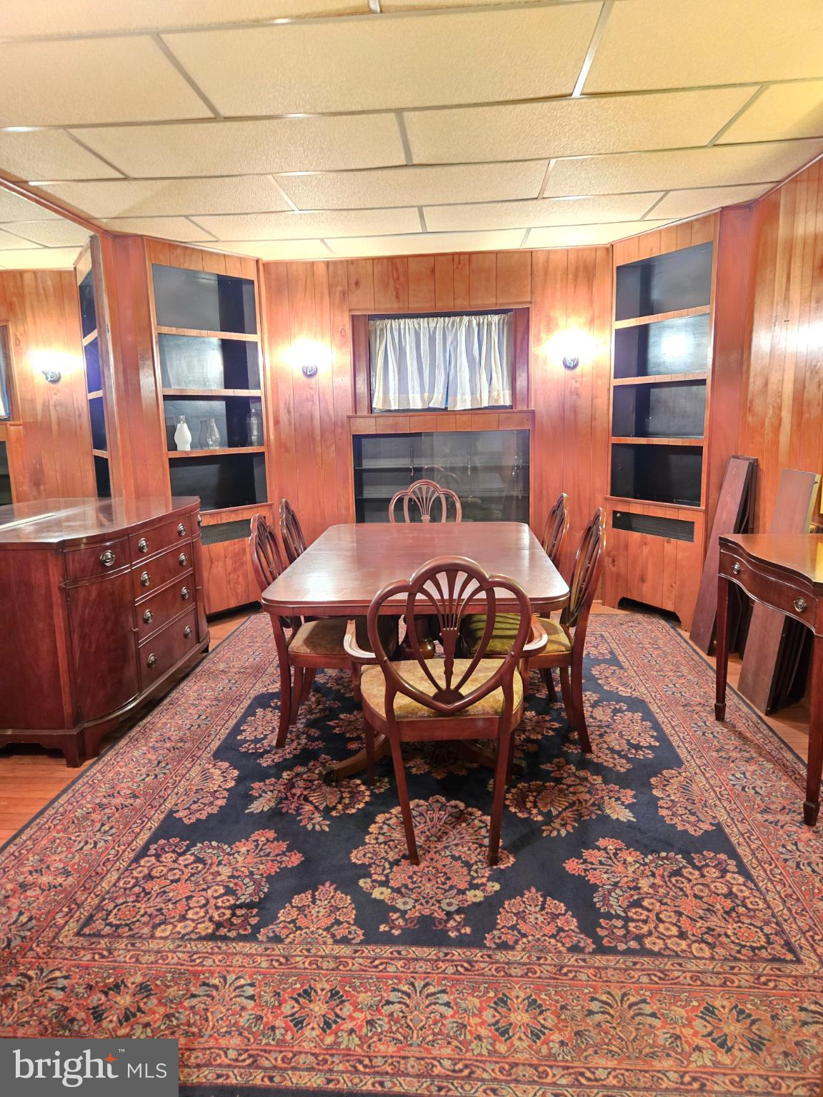 1003 Church Road Oreland, PA 19075 - Photo 5 of 18 a view of a dining room with furniture and wooden floor