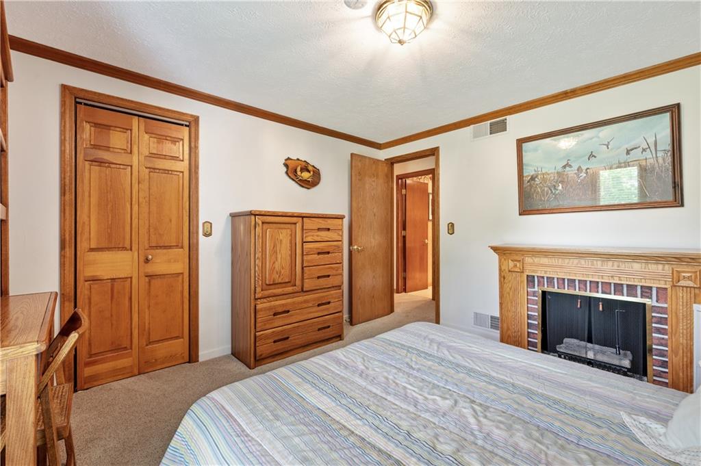 323 Wolfe Lane Irwin, PA 15642 - Photo 16 of 29 a bedroom with a bed and a dresser