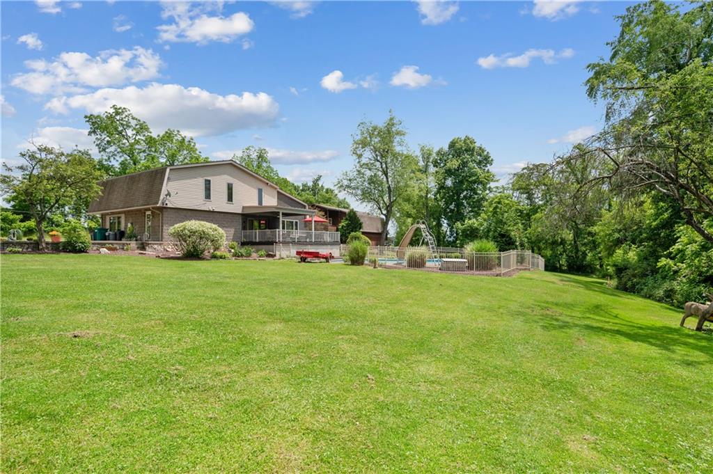 323 Wolfe Lane Irwin, PA 15642 - Photo 23 of 29 a front view of a house with garden