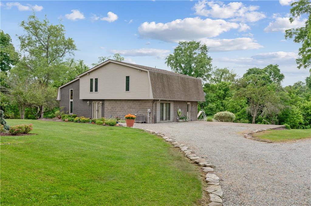 323 Wolfe Lane Irwin, PA 15642 - Photo 27 of 29 a house view with a garden space