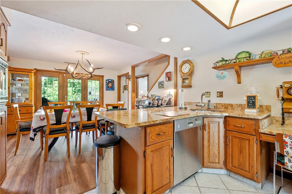 323 Wolfe Lane Irwin, PA 15642 - Photo 4 of 29 a large kitchen with lots of counter and chairs