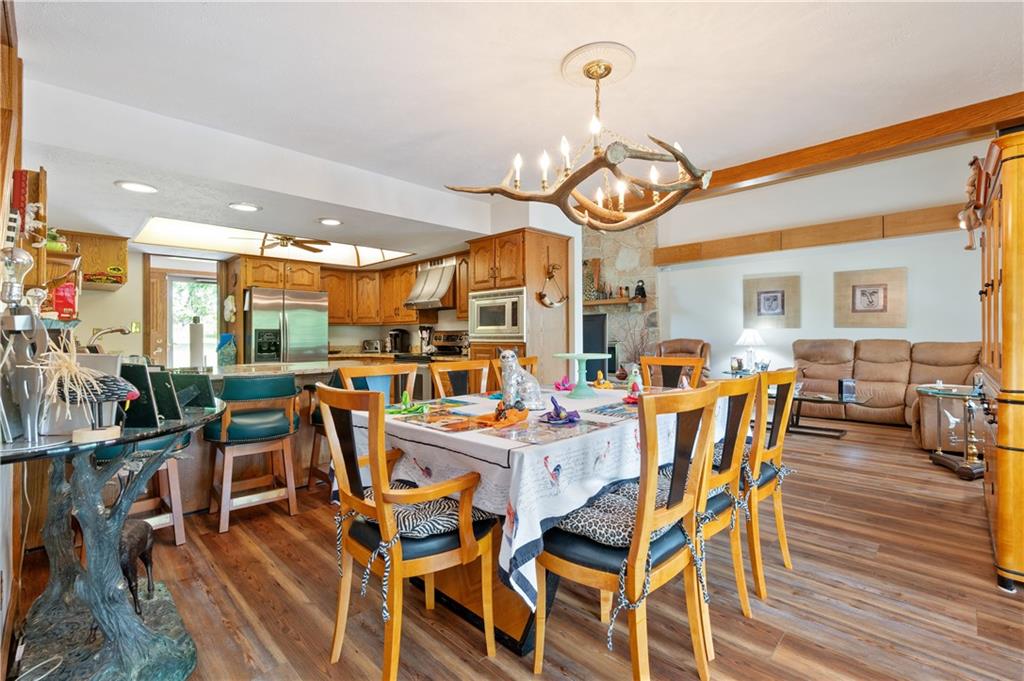 323 Wolfe Lane Irwin, PA 15642 - Photo 6 of 29 a view of a dining room with furniture window and wooden floor
