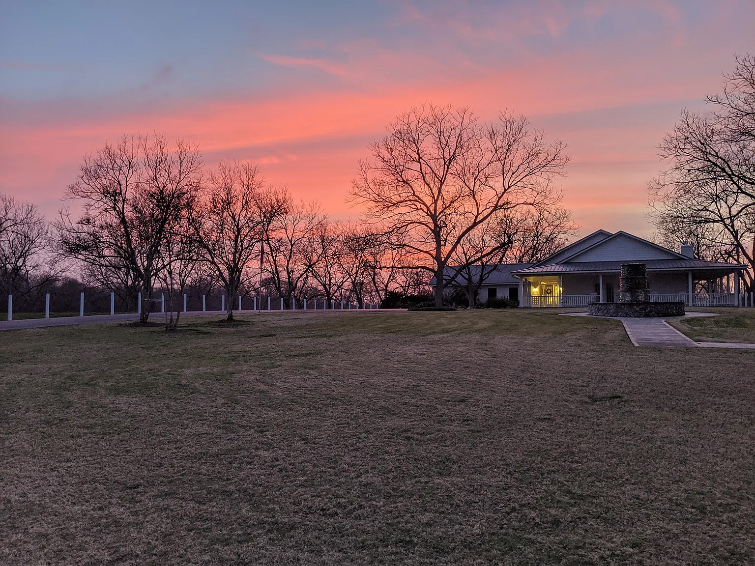 a front view of house with trees