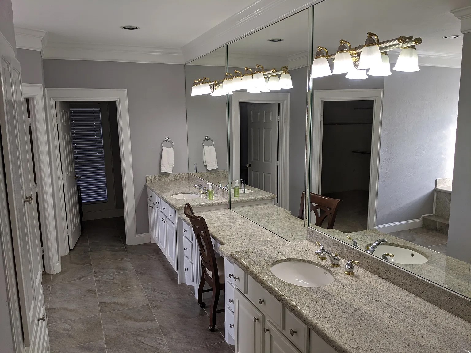4309 Bowser Road Fulshear, TX 77441 - Photo 8 of 20 a bathroom with a granite countertop double vanity sink and a mirror