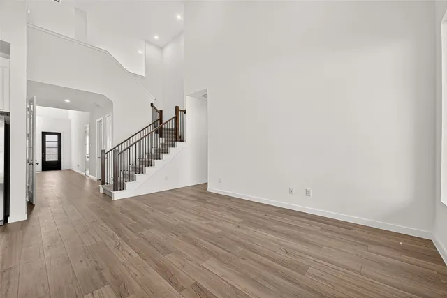 a kitchen with white cabinets and appliances