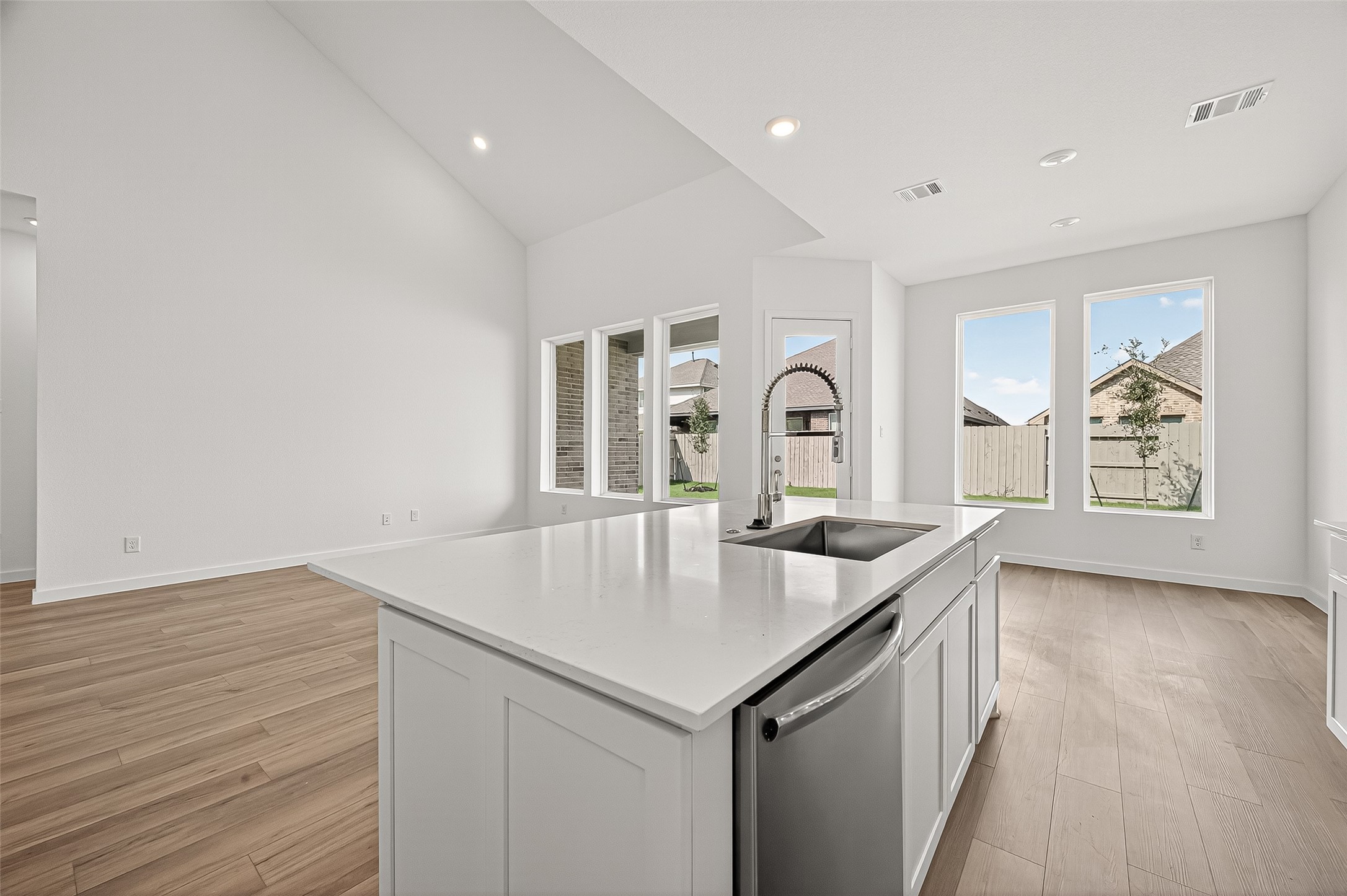 2419 Hazel Berry Street Manvel, TX 77578 - Photo 18 of 50 a living room with kitchen island furniture and a wooden floor