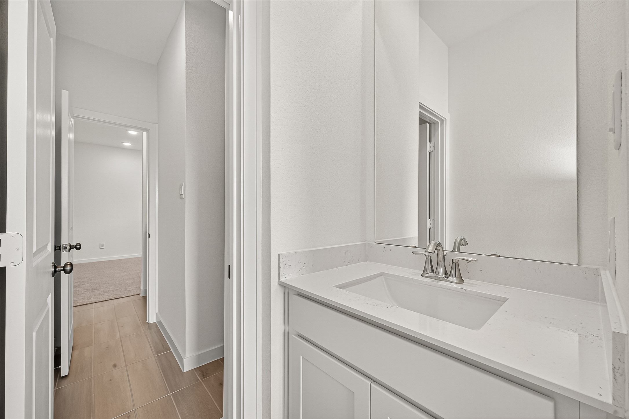 2419 Hazel Berry Street Manvel, TX 77578 - Photo 43 of 50 a bathroom with a sink and a mirror