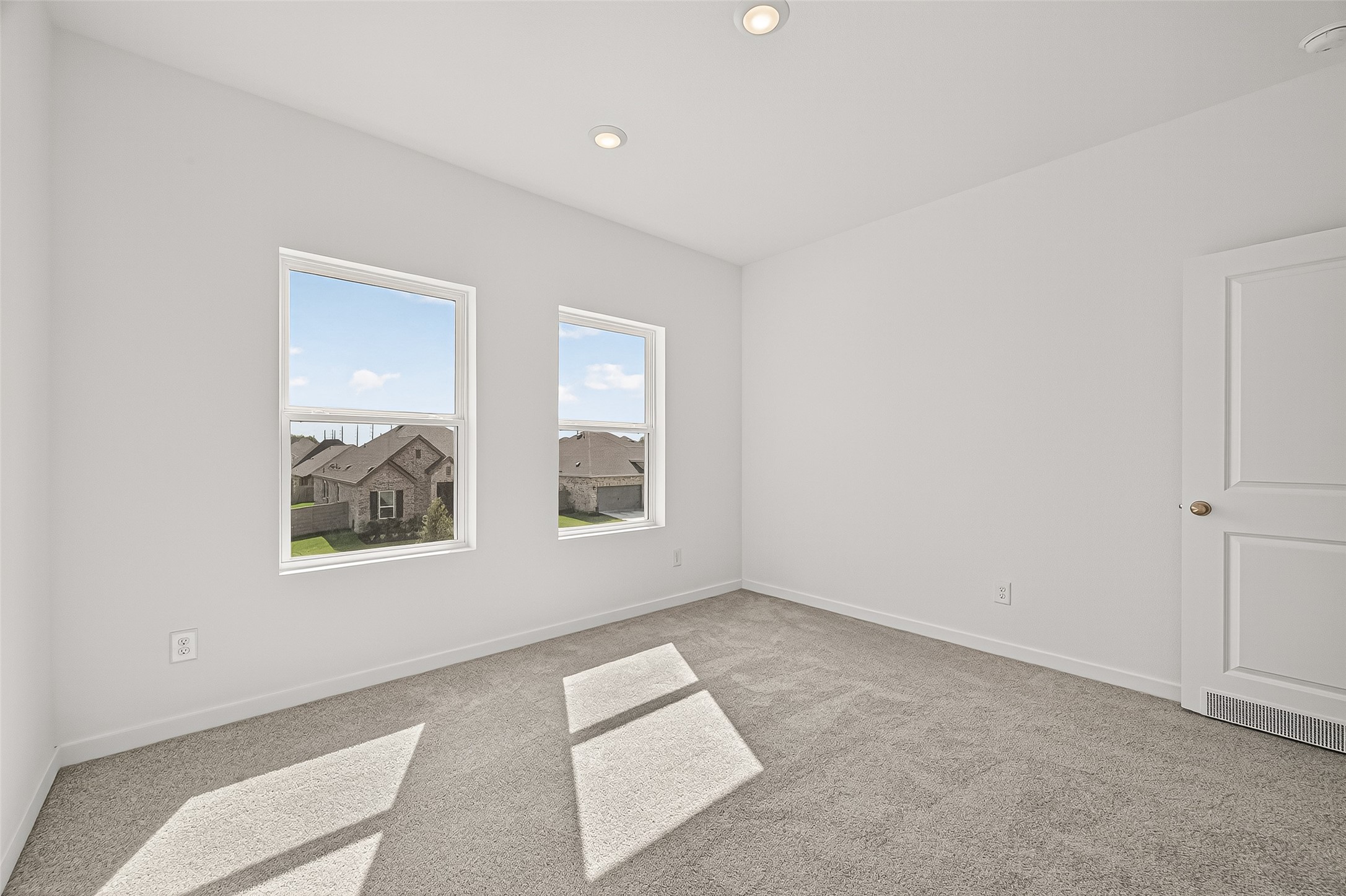 2419 Hazel Berry Street Manvel, TX 77578 - Photo 45 of 50 an empty room with windows