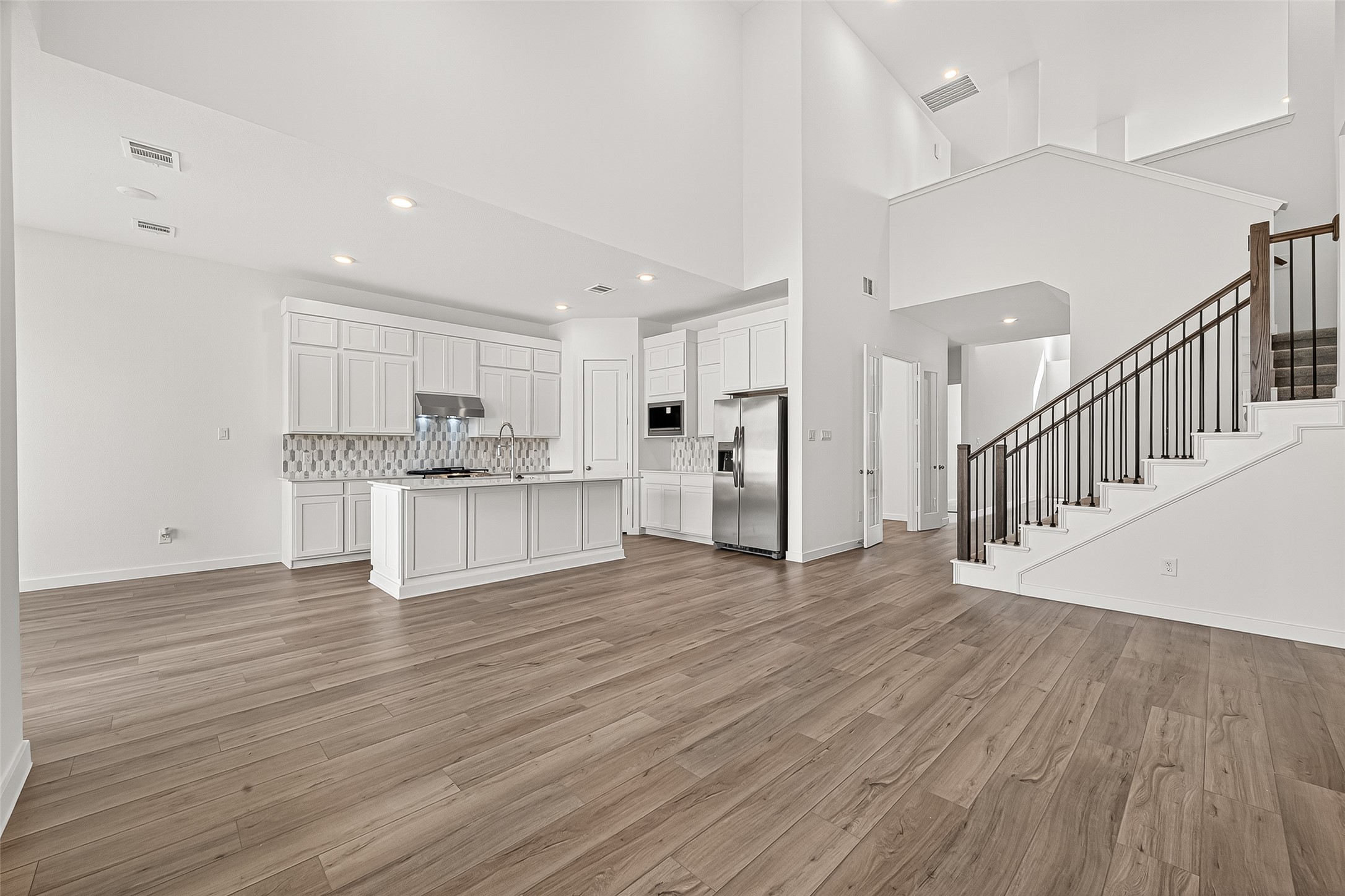 2419 Hazel Berry Street Manvel, TX 77578 - Photo 10 of 50 a view of an empty room and wooden floor