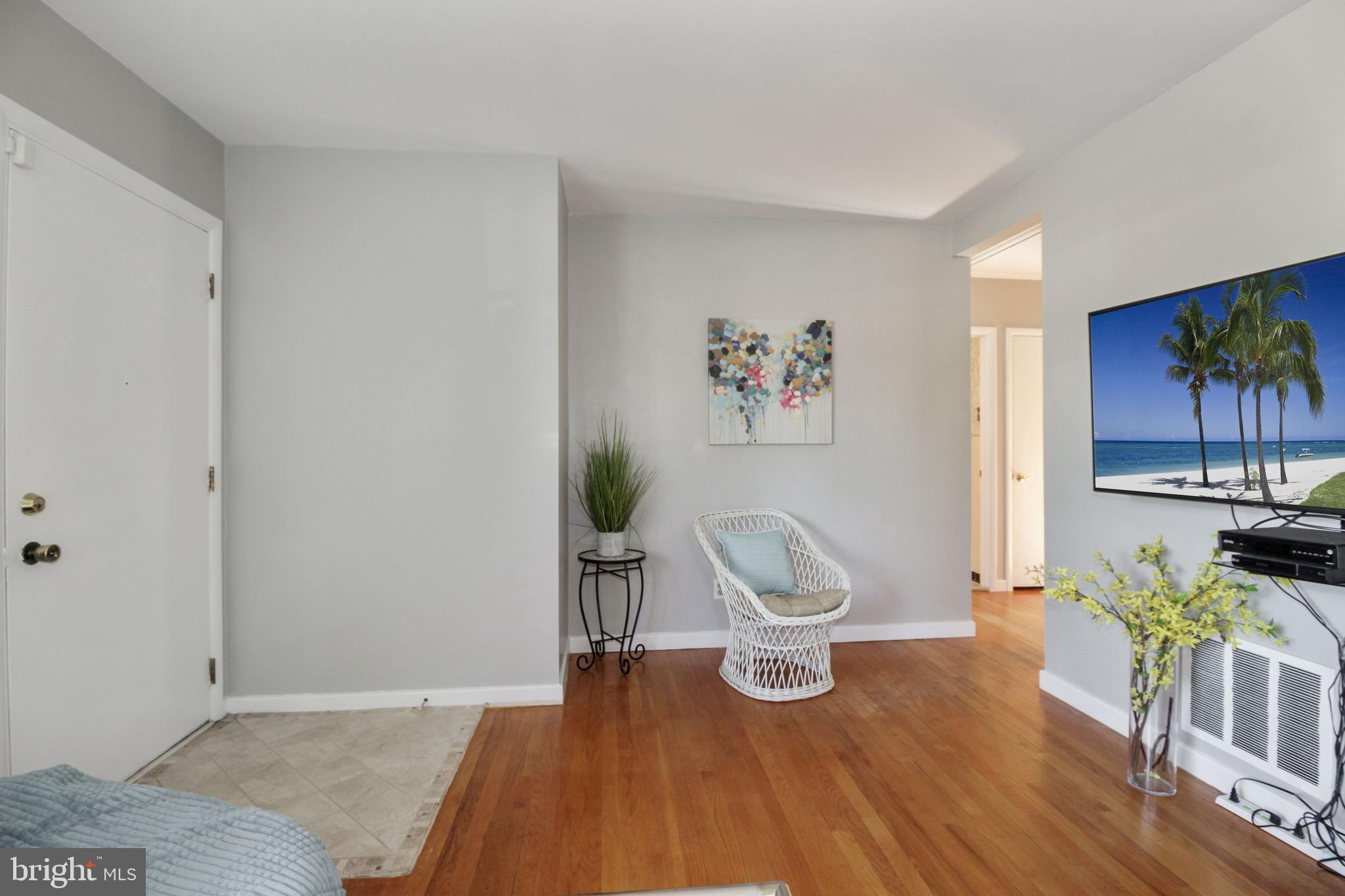 6307 Tramore Road Baltimore, MD 21214 - Photo 5 of 19 a view of a livingroom with furniture and a potted plant