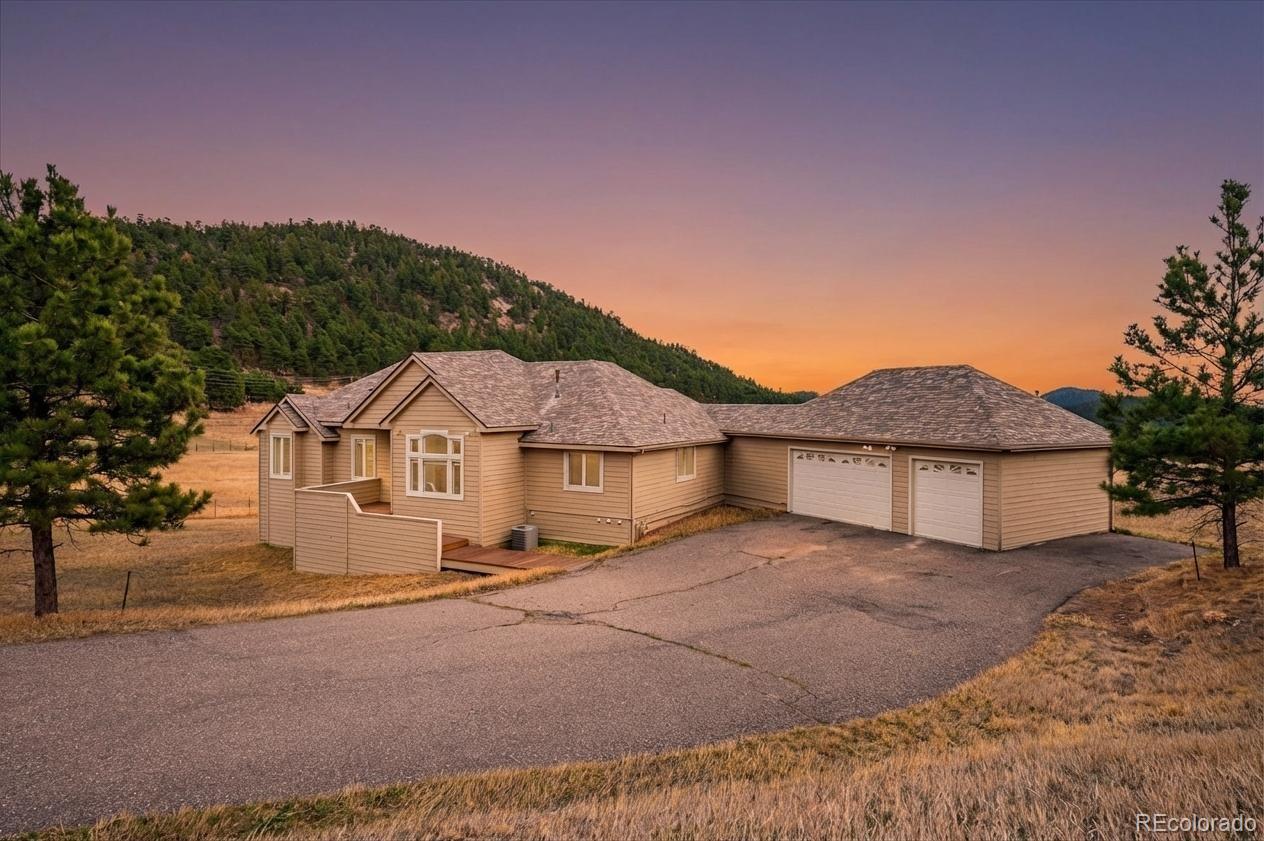 6320 Valley Lane Morrison, CO 80465 - Photo 1 of 28 a view of a house with a outdoor space