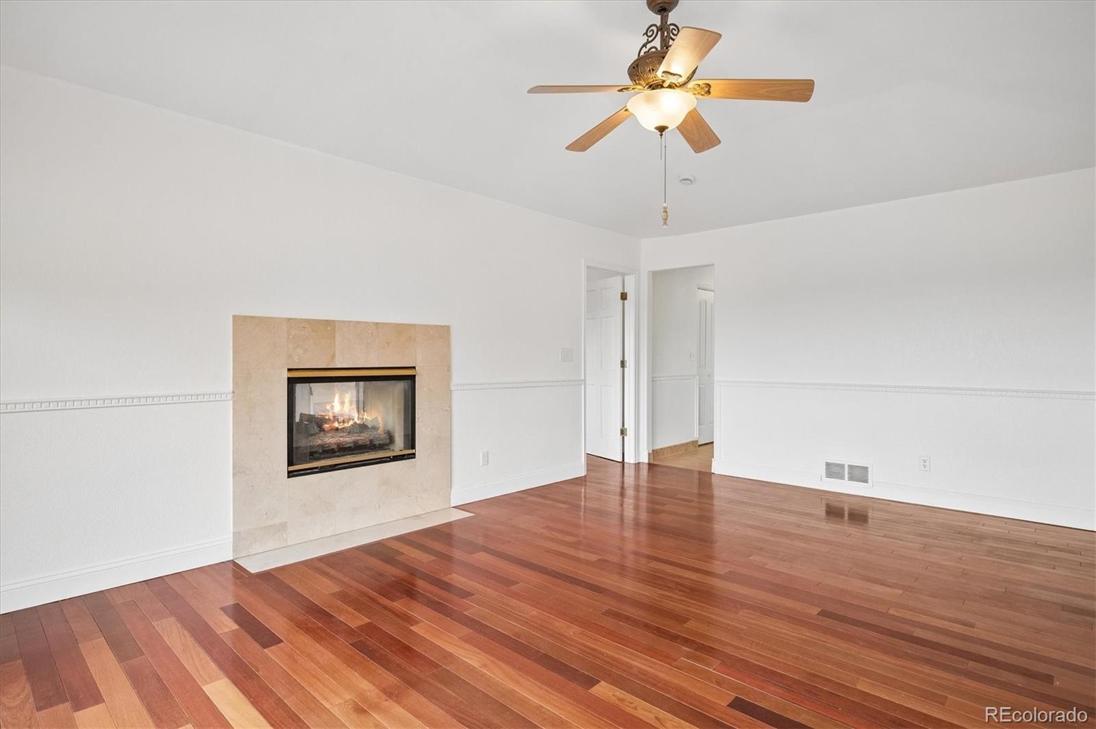 6320 Valley Lane Morrison, CO 80465 - Photo 11 of 28 a view of empty room with wooden floor and fan