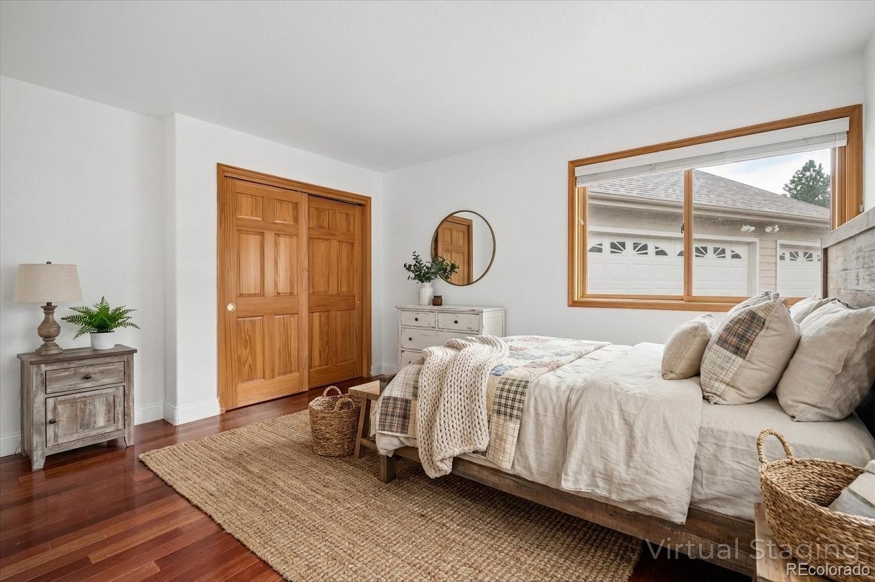 6320 Valley Lane Morrison, CO 80465 - Photo 16 of 28 a bedroom with a bed and a large window