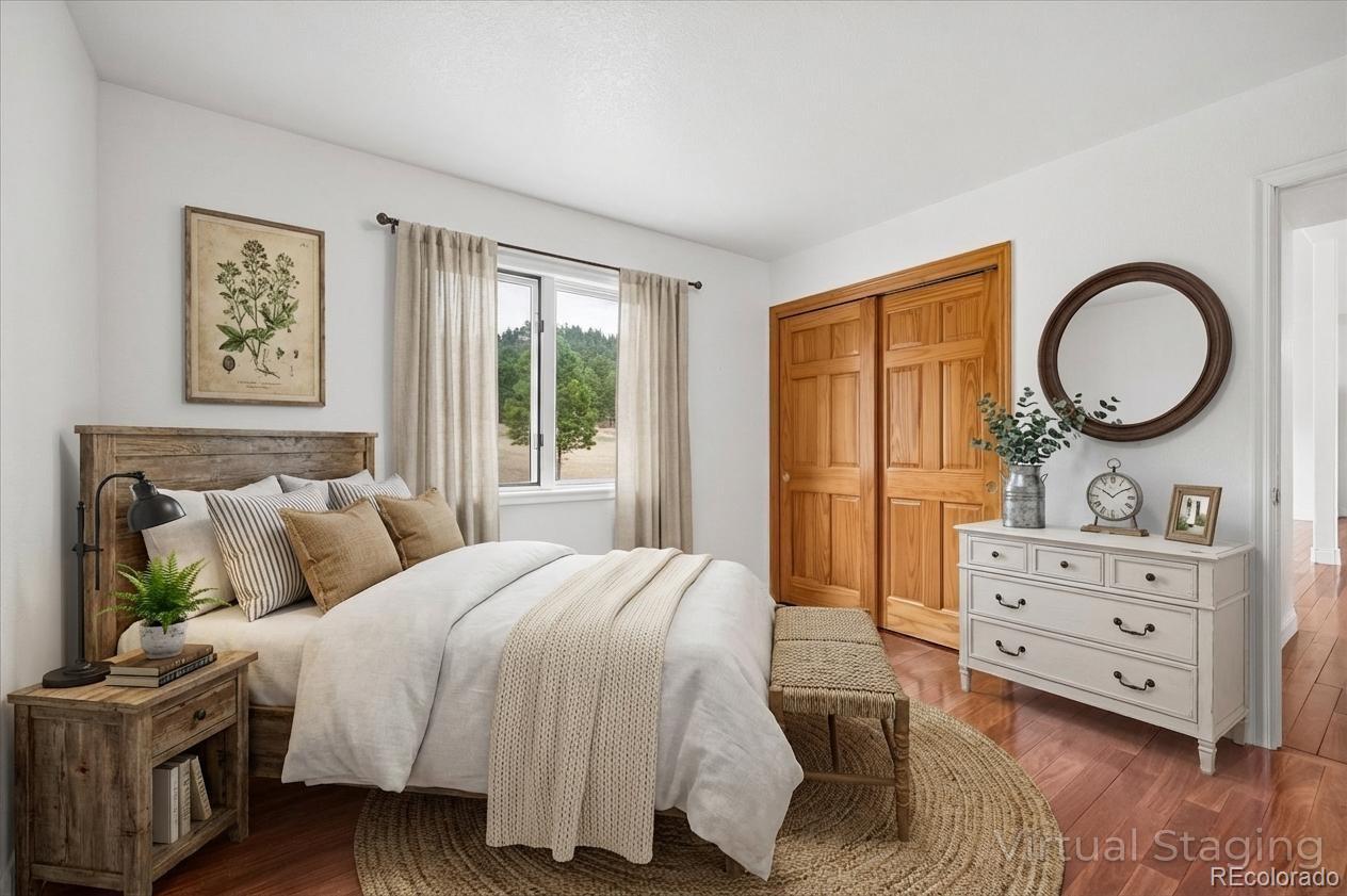 6320 Valley Lane Morrison, CO 80465 - Photo 17 of 28 a bedroom with a bed and a dresser