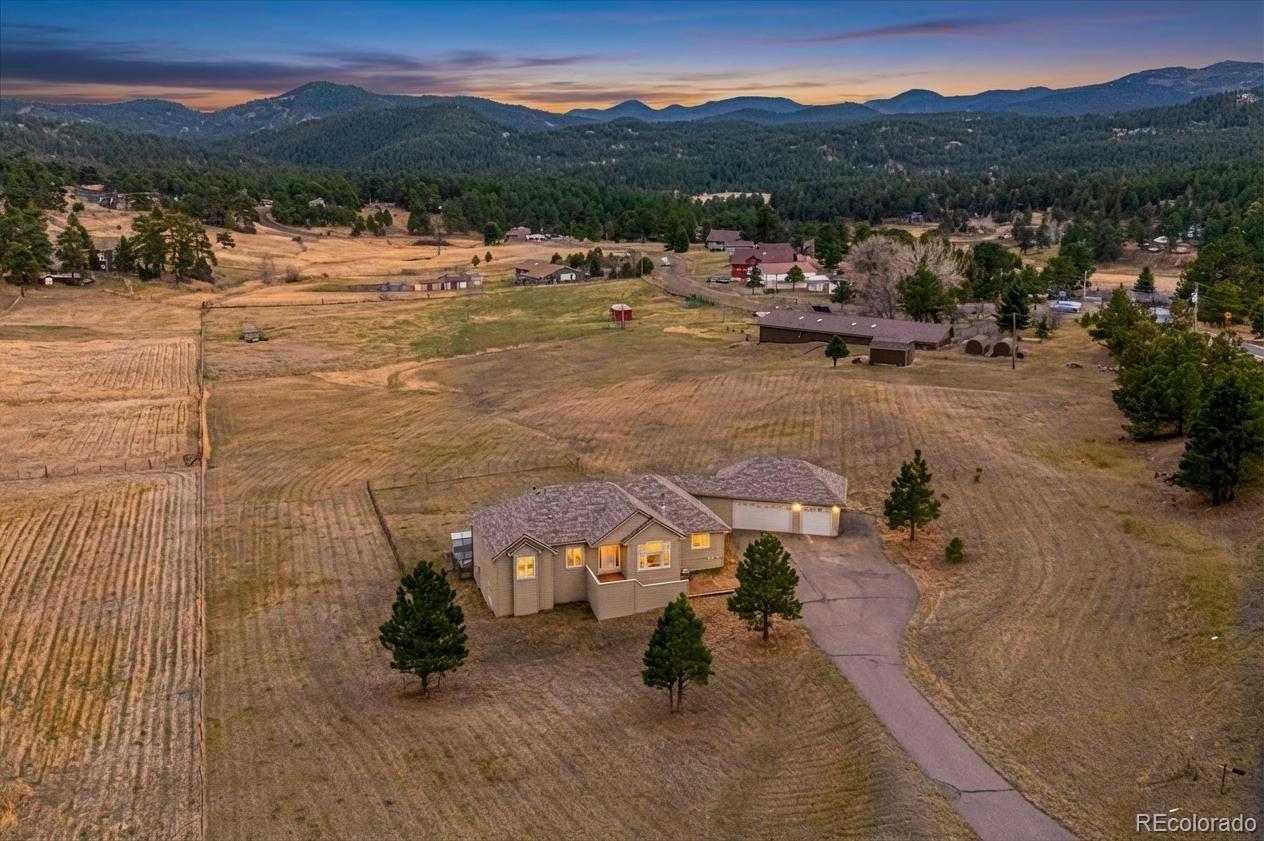 6320 Valley Lane Morrison, CO 80465 - Photo 2 of 28 a view of a lake with mountains in the background