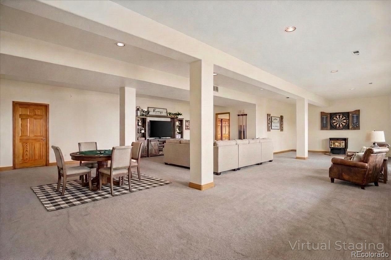 6320 Valley Lane Morrison, CO 80465 - Photo 21 of 28 a living room with furniture and a dining table with kitchen view
