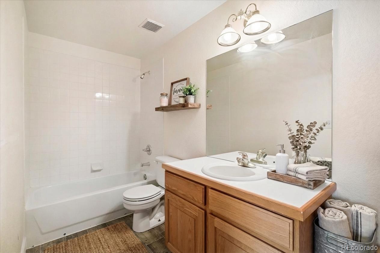 6320 Valley Lane Morrison, CO 80465 - Photo 23 of 28 a bathroom with a sink a toilet and a bathtub