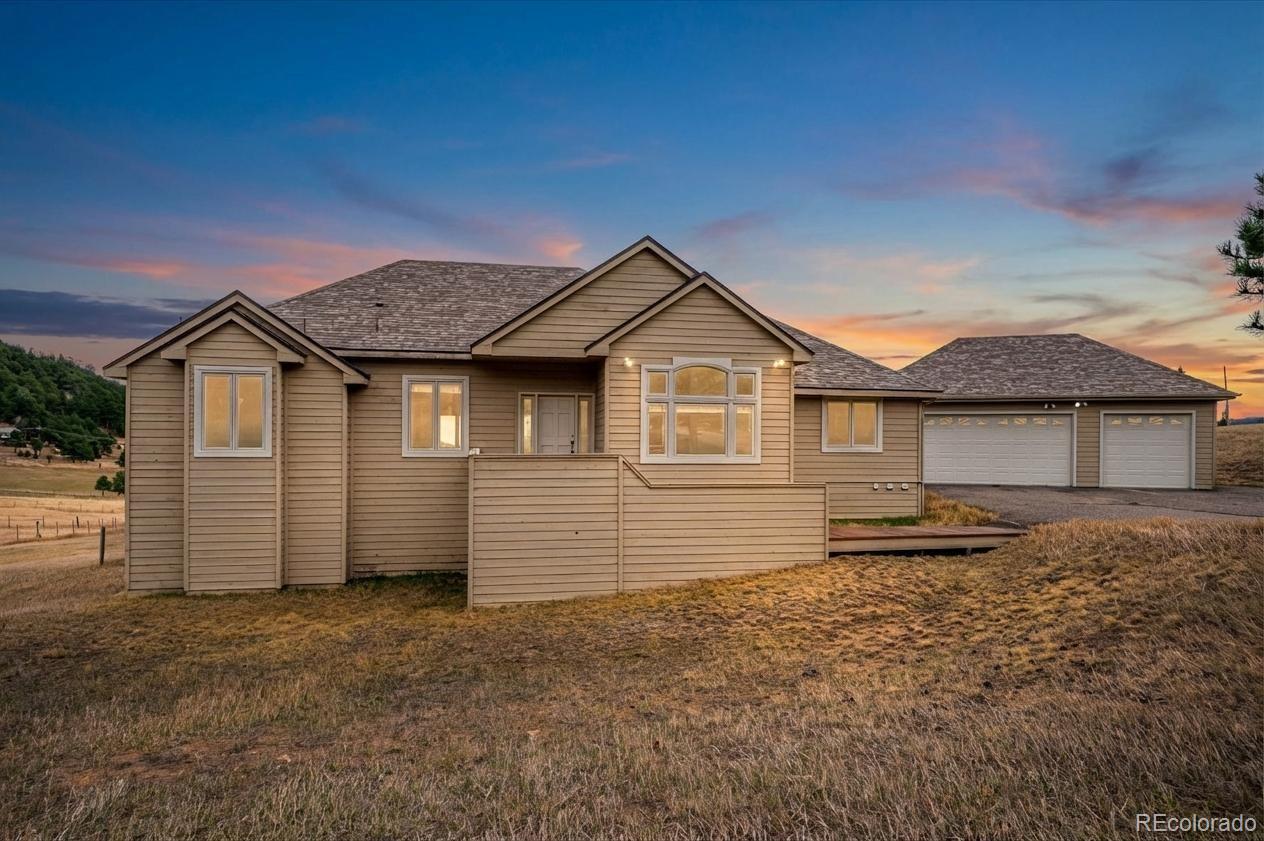 6320 Valley Lane Morrison, CO 80465 - Photo 3 of 28 a front view of a house with a yard