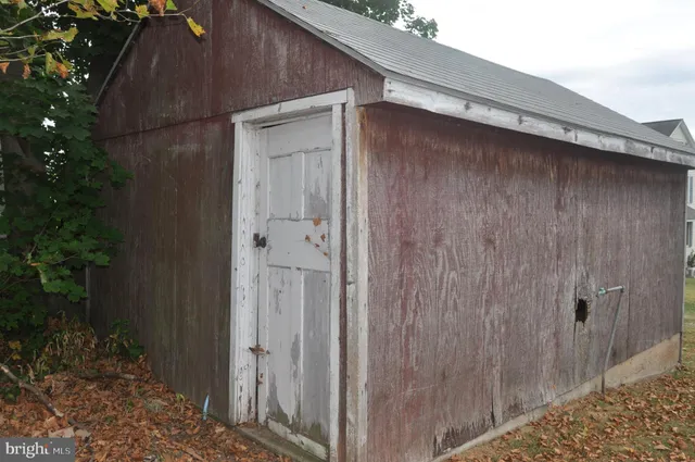 a backyard of a house with yard and garage