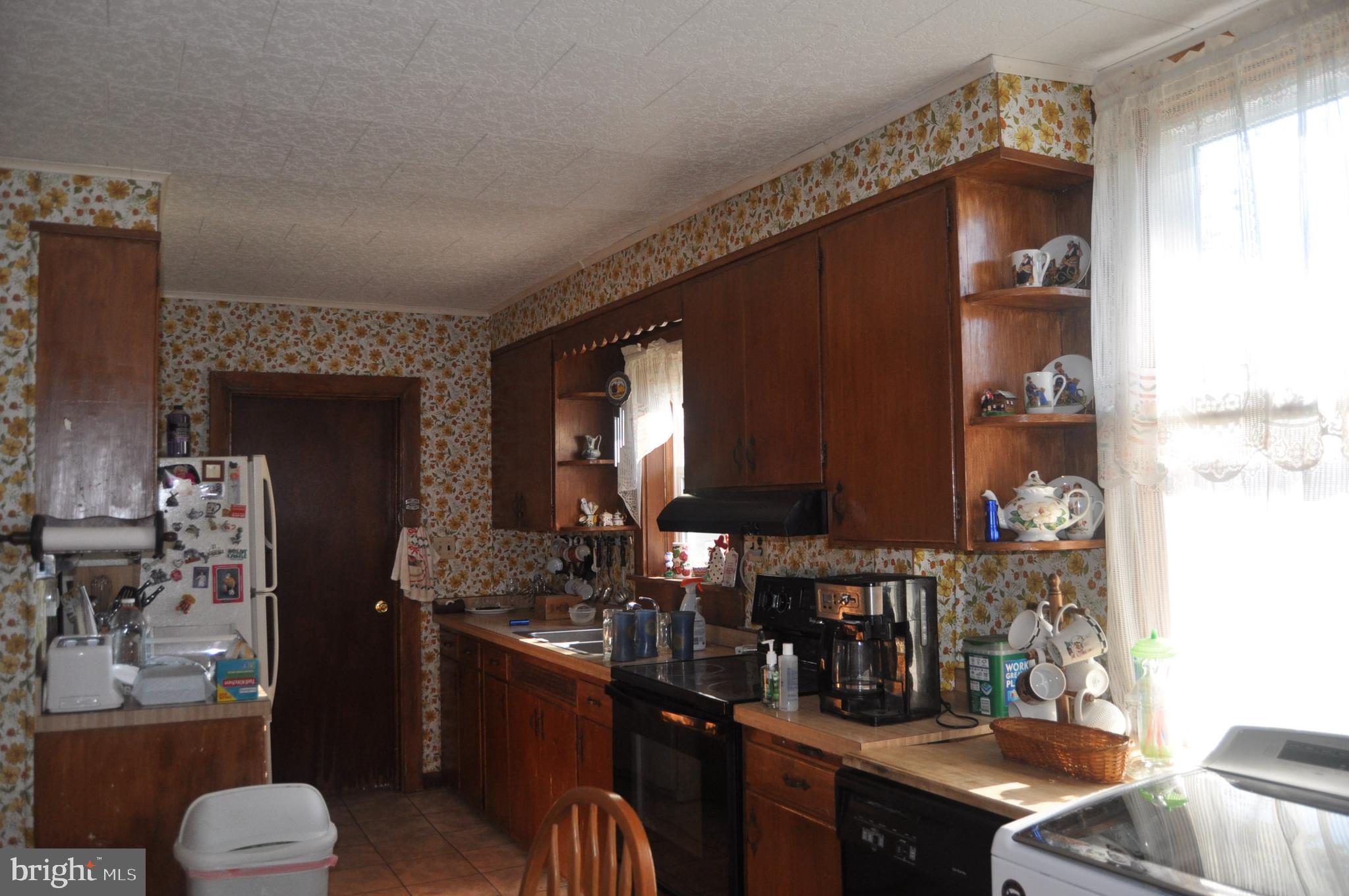 1496 Highway 25 Millersburg, PA 17061 - Photo 8 of 22 a kitchen with stainless steel appliances granite countertop a stove refrigerator and cabinets