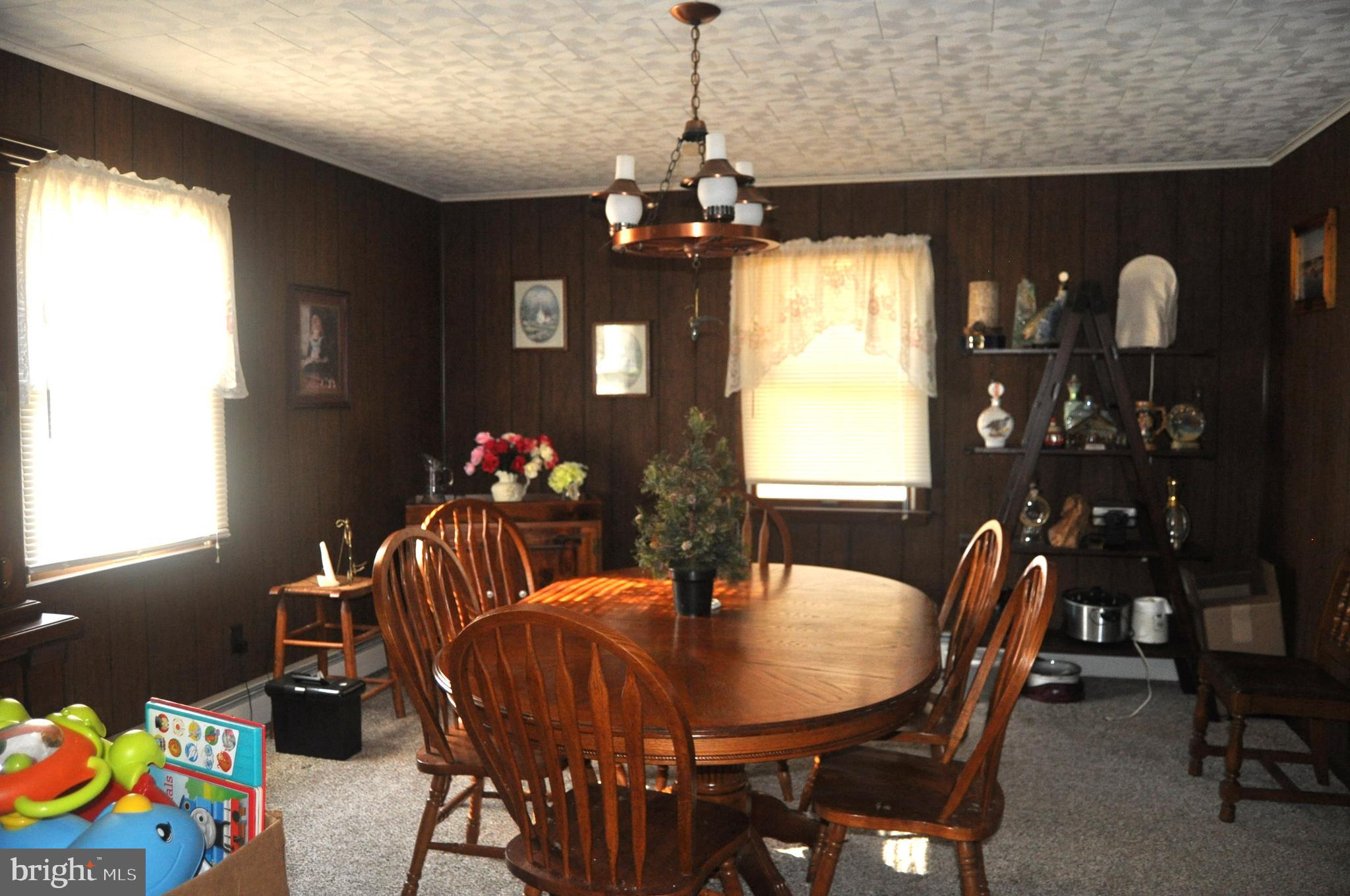 1496 Highway 25 Millersburg, PA 17061 - Photo 9 of 22 a dining room with furniture potted plants and wooden floor