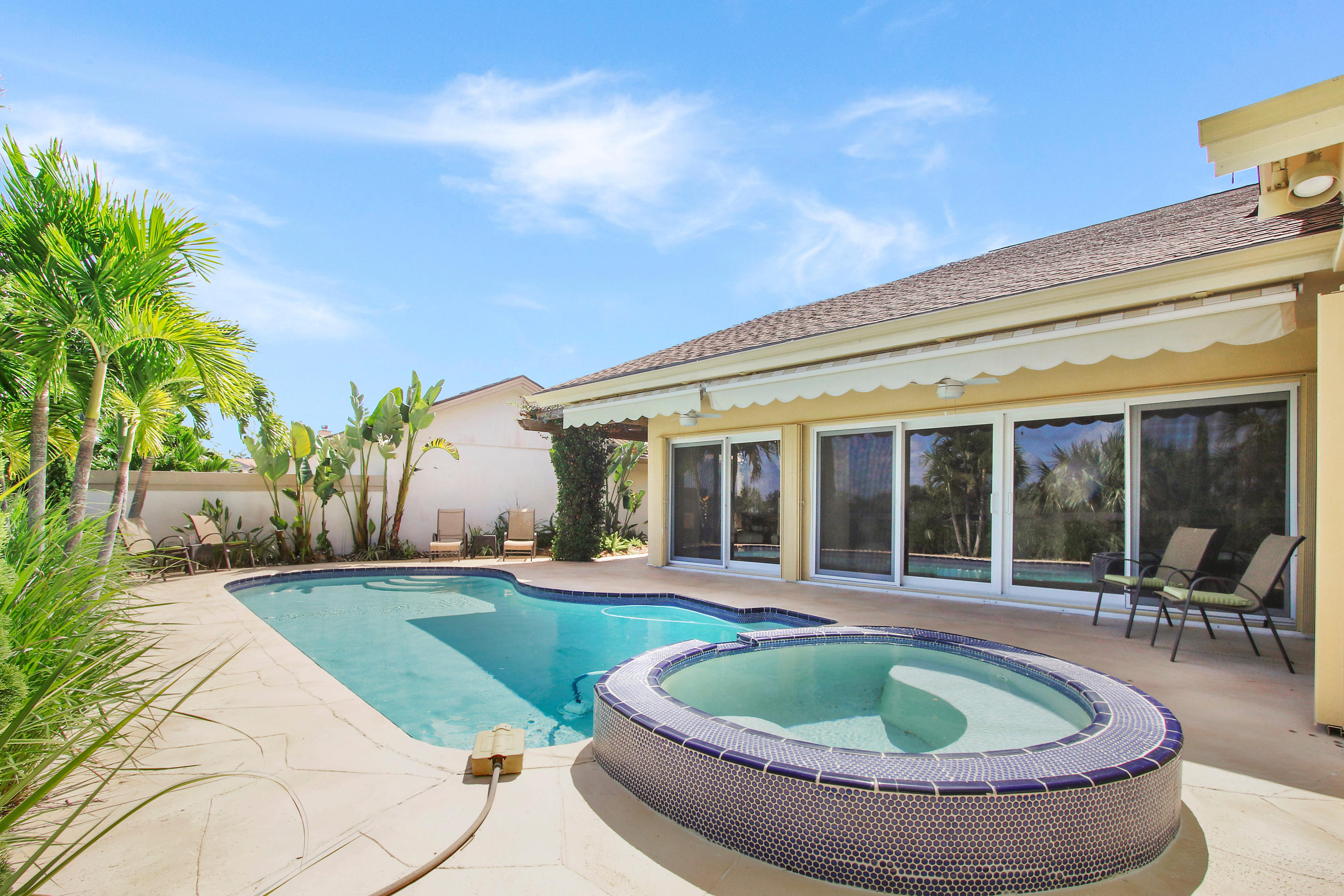 317 Ridge Road Jupiter, FL 33477 - Photo 26 of 33 Pool View and Retracted Awnings