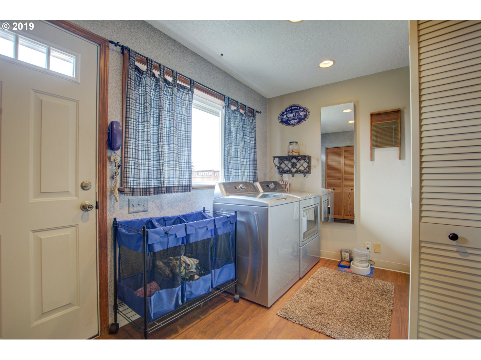 6180 Southeast Lusted Road Gresham, OR 97080 - Photo 11 of 30 a room with a baby crib furniture a window and a dresser