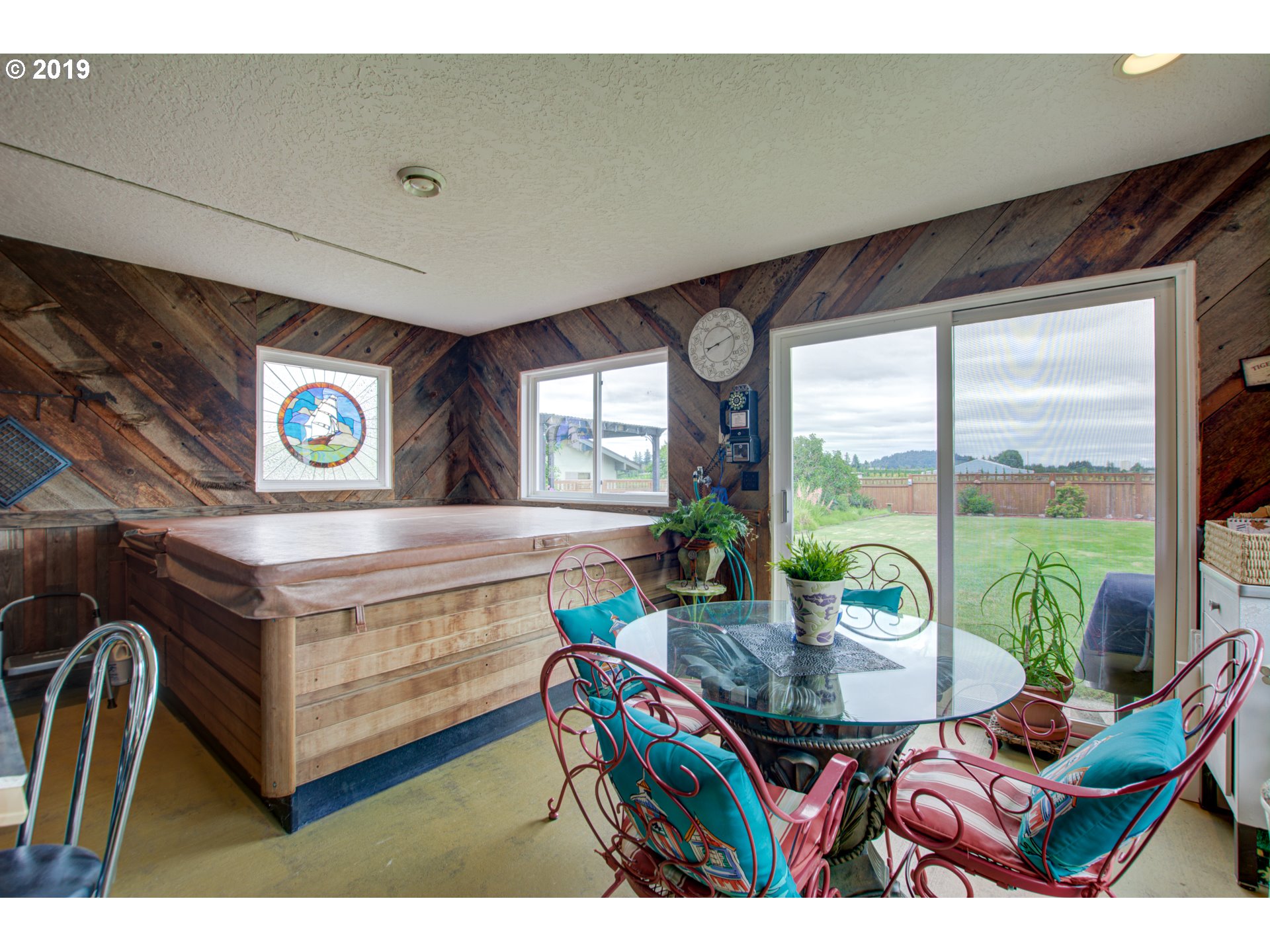 6180 Southeast Lusted Road Gresham, OR 97080 - Photo 17 of 30 a living room with furniture a floor to ceiling window and floor to ceiling window