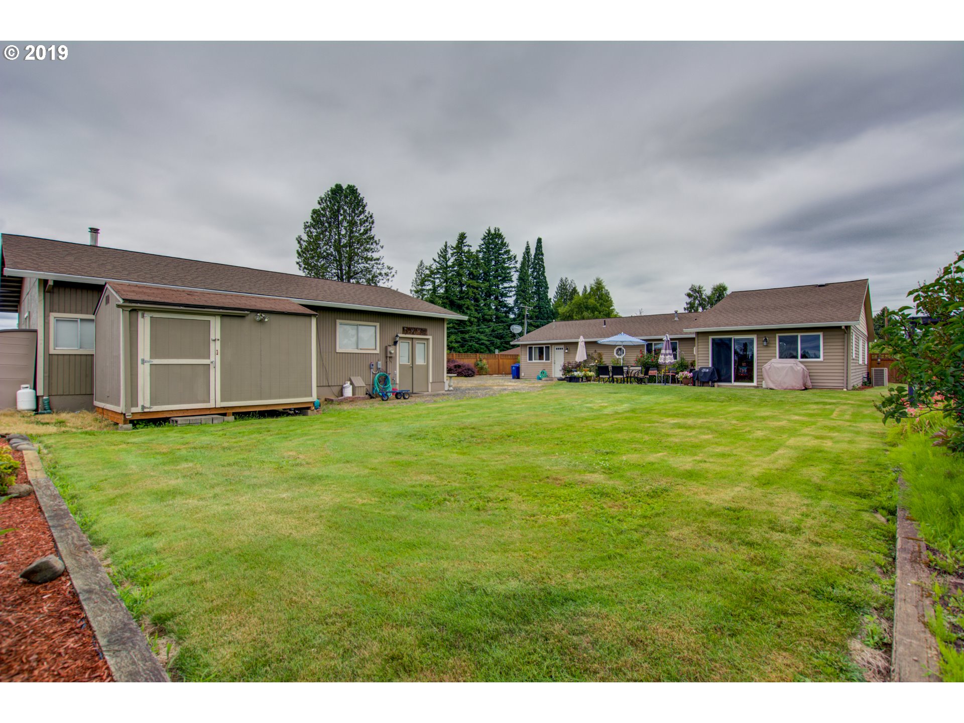 6180 Southeast Lusted Road Gresham, OR 97080 - Photo 26 of 30 a front view of house with a garden