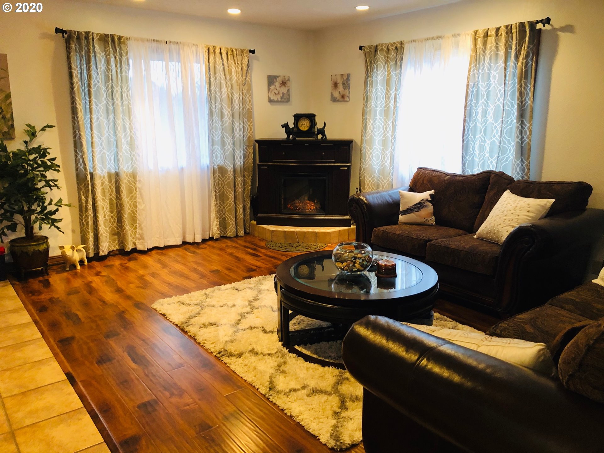 6180 Southeast Lusted Road Gresham, OR 97080 - Photo 5 of 30 a living room with furniture and a fireplace