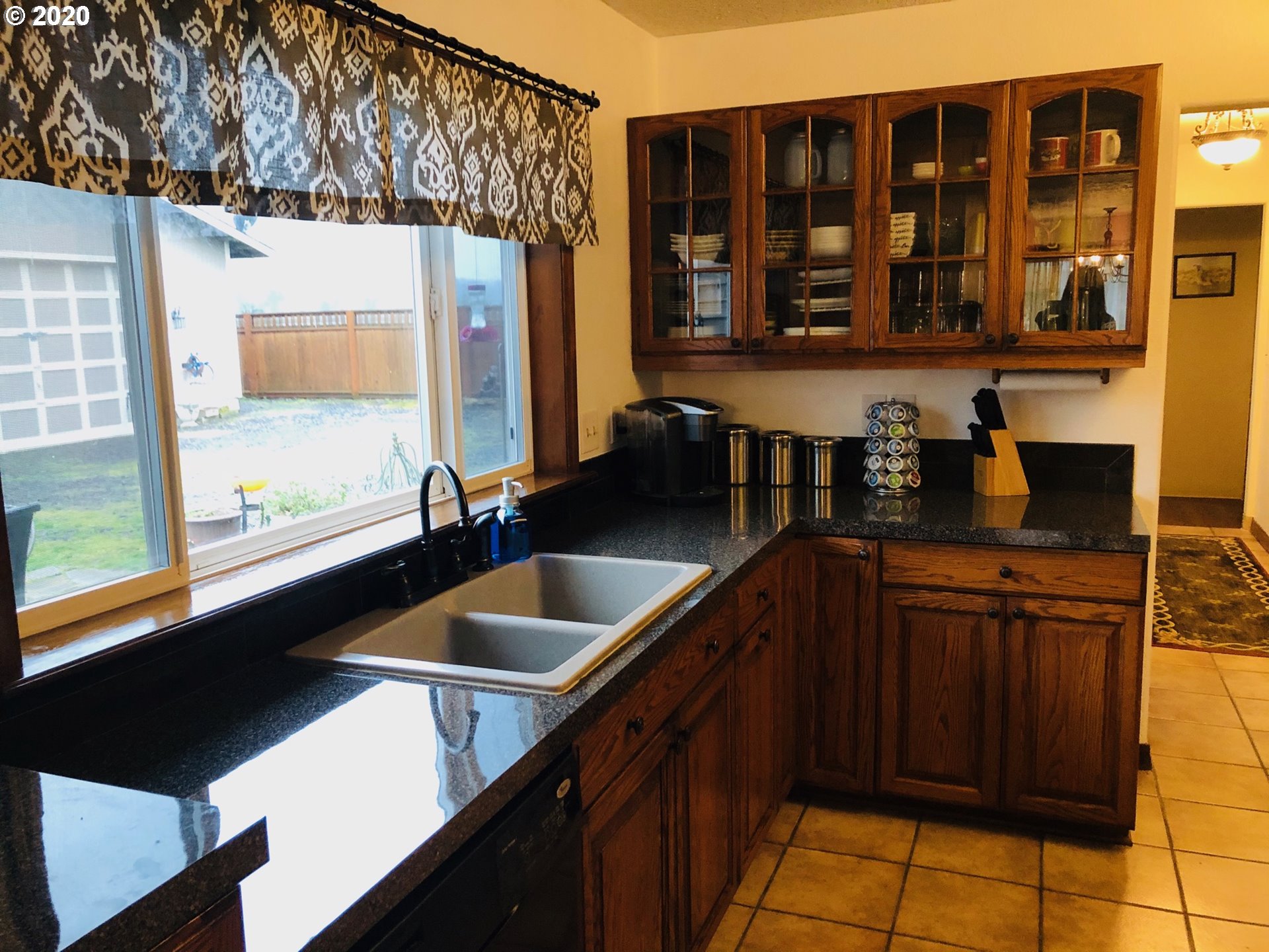 6180 Southeast Lusted Road Gresham, OR 97080 - Photo 9 of 30 a kitchen with a sink and cabinets