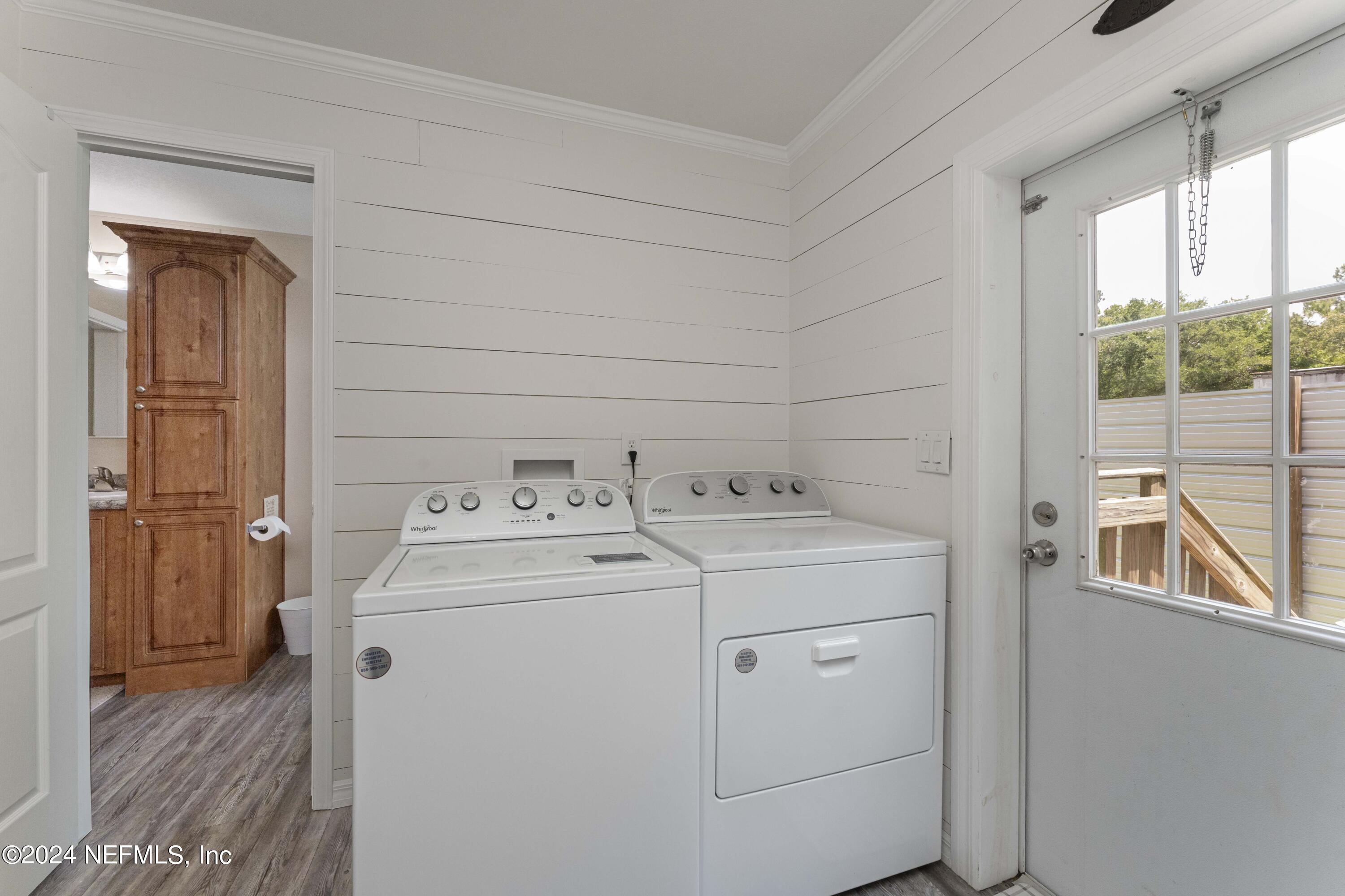4866 Reed Avenue Jacksonville, FL 32257 - Photo 19 of 25 a utility room with dryer and washer